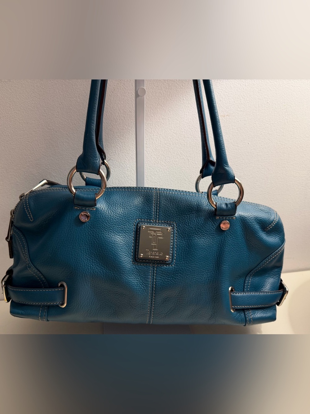 Tignanello teal blue pebbled leather satchel with silver toned hardware.